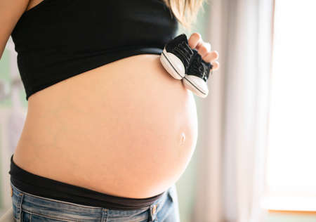 A Beautiful Pregnant mother on baby room
