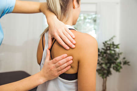 A Modern rehabilitation physiotherapist at work with client