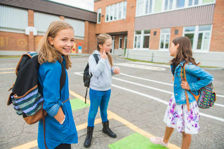 Some nice kids on the school background having funの写真素材