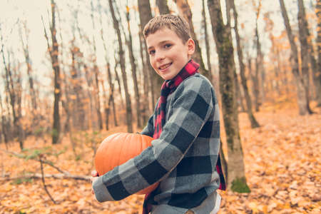 portrait of child in the autumn season outside