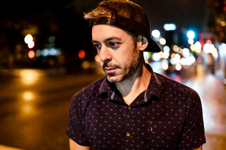 A Handsome man portrait in the city at night