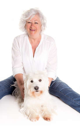 A Elderly woman with her Westie dog
