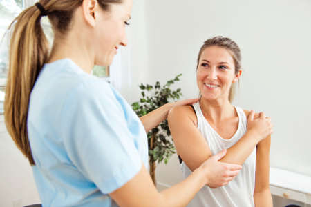 A Modern rehabilitation physiotherapist at work with client