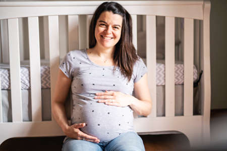 A Beautiful Pregnant mother on baby room
