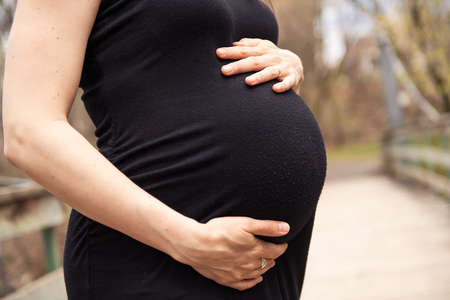 beautiful portrait of pregnant woman in natureの写真素材