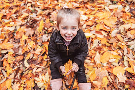 portrait of child in the autumn season outsideの写真素材