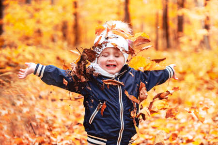 portrait of child in the autumn season outside