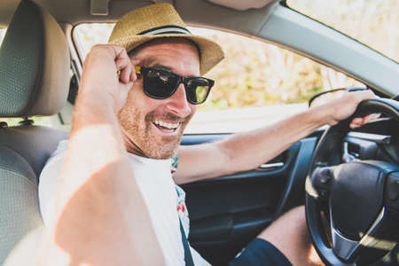 Men sitting in a rental car background.の写真素材