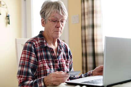 Senior woman buying on internet with credit card