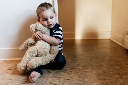 Upset problem child close to the staircase concept for bullying, depression stressの写真素材