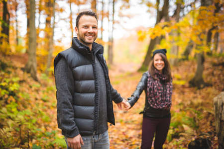 Young couple in love in a park on a autumn dayの写真素材