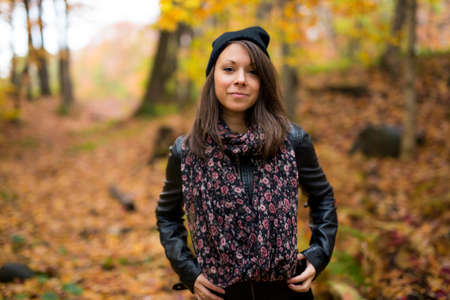 Portrait of cheerful young woman in autumn seasonの写真素材