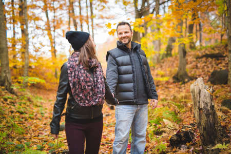 Young couple in love in a park on a autumn dayの写真素材