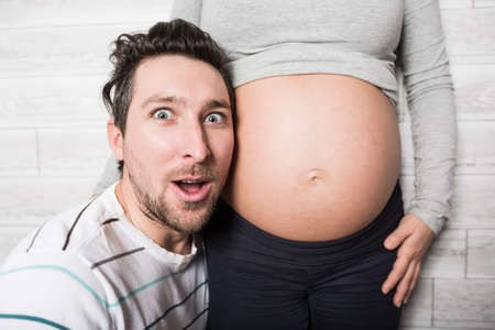 Pregnant Mother and her husband on baby room