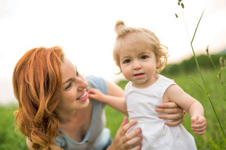 Young beautiful mother her little toddler daughter