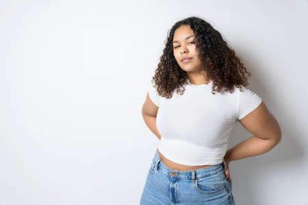 Studio portrait of beautiful brunette young dark-skinned womanの写真素材