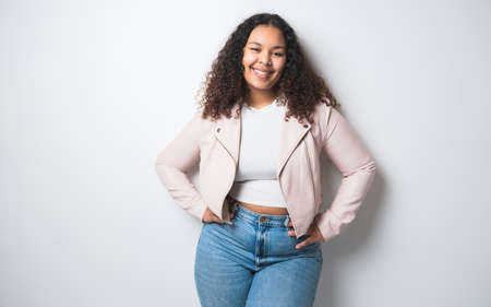 Studio portrait of beautiful brunette young dark-skinned womanの写真素材