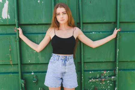 Nice and cool teen girl standing portraitの写真素材
