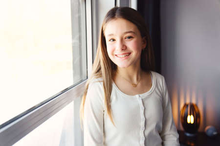 Teen spending time on bedroom at homeの写真素材