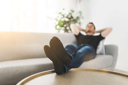 A Relaxing man and dreaming on sofa at homeの写真素材