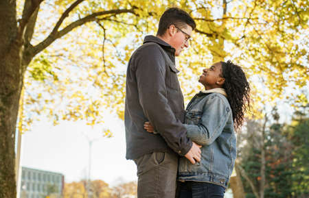 Romantic Teenage Couple In Autumn Park outside