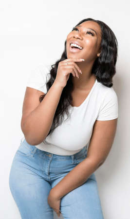Studio portrait of beautiful brunette young dark-skinned woman,