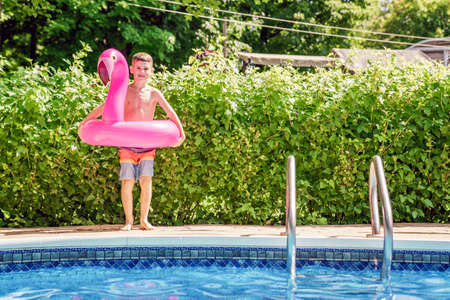 kid having fun on in a swimming pool.の写真素材