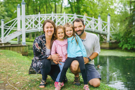 nice family having fun in summer forestの写真素材