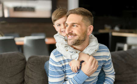 Father or Godfather having fun on the living room At Homeの写真素材