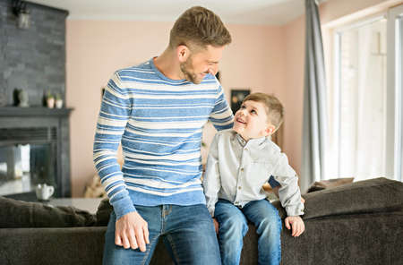 Father or godfather having fun on the living room At Homeの写真素材