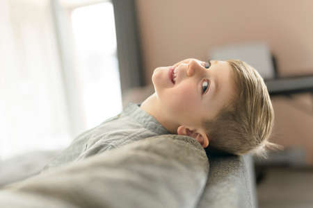 Happy kid in living room at home