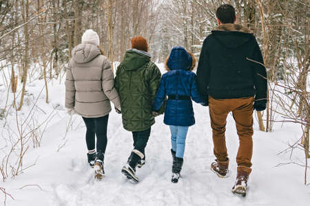 Portrait of a four Family On forest Winter seasonの写真素材