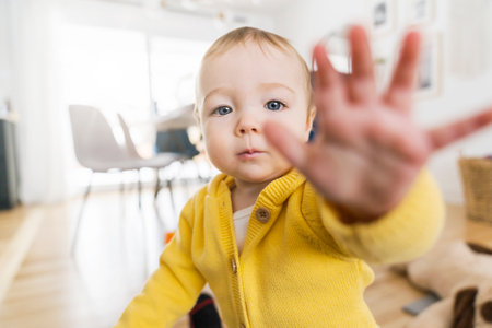 little baby girl with touch hand showing at home