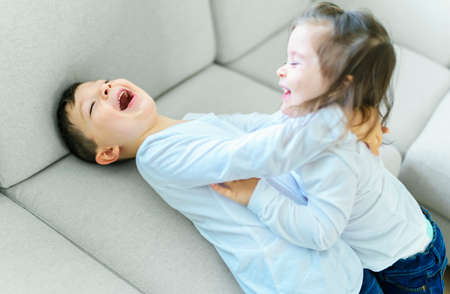 childs having fun on living room at home