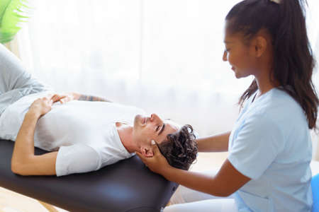 black rehabilitation woman physiotherapy at physio clinic with customer
