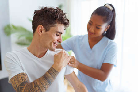 black rehabilitation woman physiotherapy at physio clinic with customer