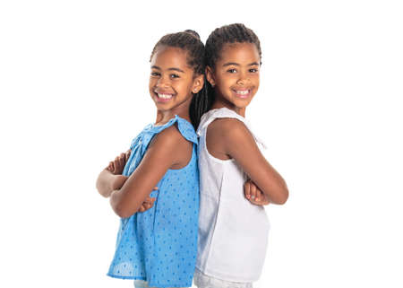 Two Adorable african twin girl on studio white background