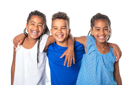 portrait of happy three black childrens, white backgroundの写真素材