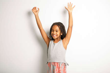 Adorable african little girl on studio white background