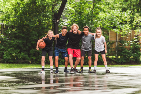 great child Team in sportswear playing basketball game