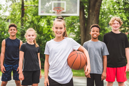 great child Team in sportswear playing basketball game