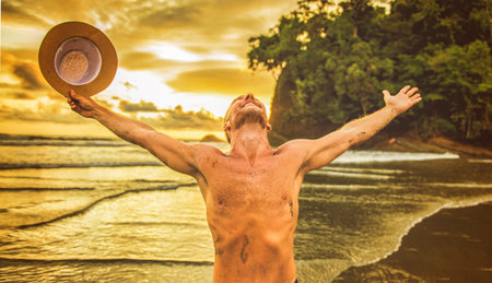 nice man having great time on beachの写真素材