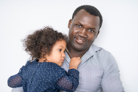 Father with little daughter at home consoling