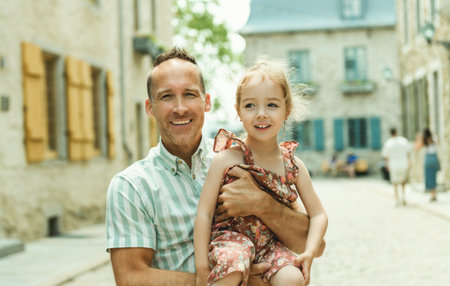 father and daughter in summer season in quebec cityの写真素材