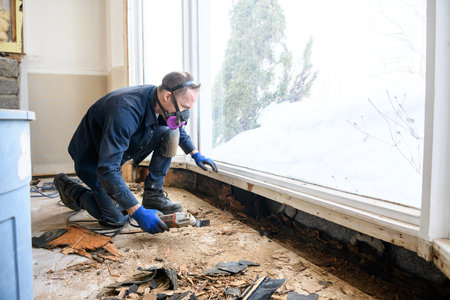 Working try to repair a broken window. Water insideの写真素材