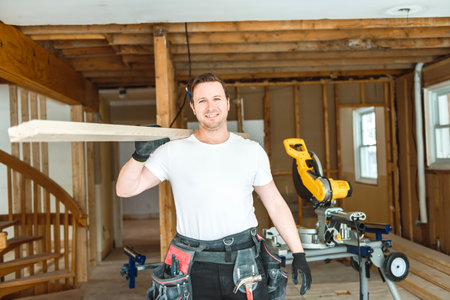 Carpenter men working in an old houseの写真素材