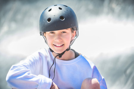 child girl playing skate or skateboard at parking to wearing safety helmetの写真素材