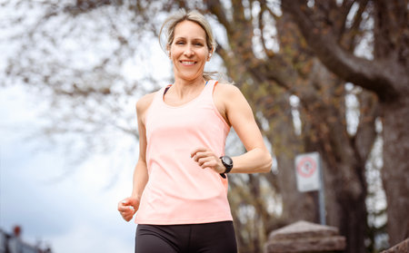 Female Runner Jogging during Outdoor Workout in a Park