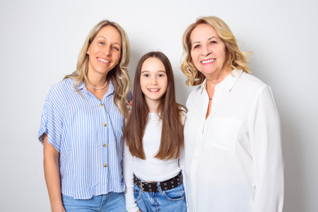 Studio shot of two women. senior Mother, Daughter and little girl