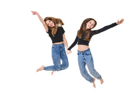 Two Young pre teen best friend girl on studio whiteの写真素材